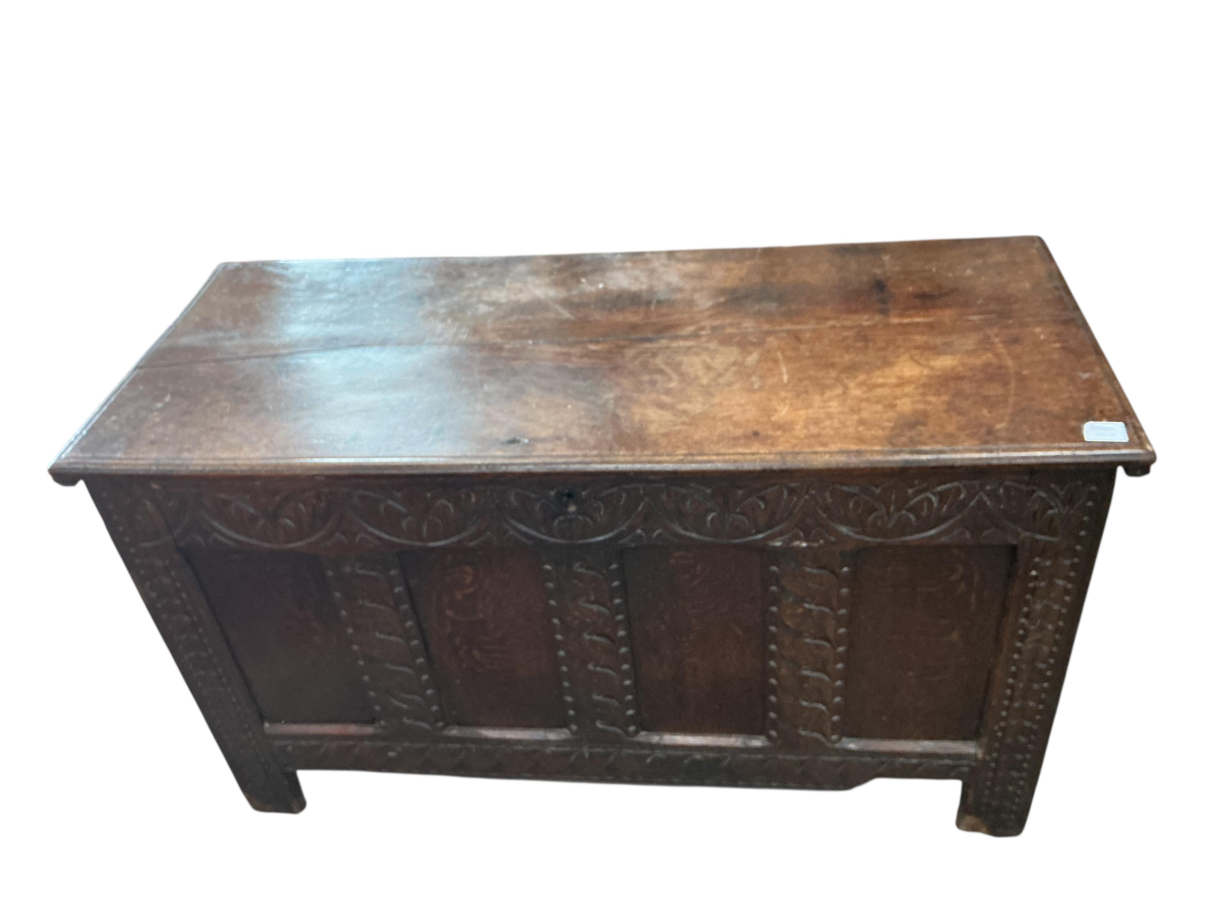 A 17th century carved oak coffer, width 126cm, depth 53cm, height 72cm